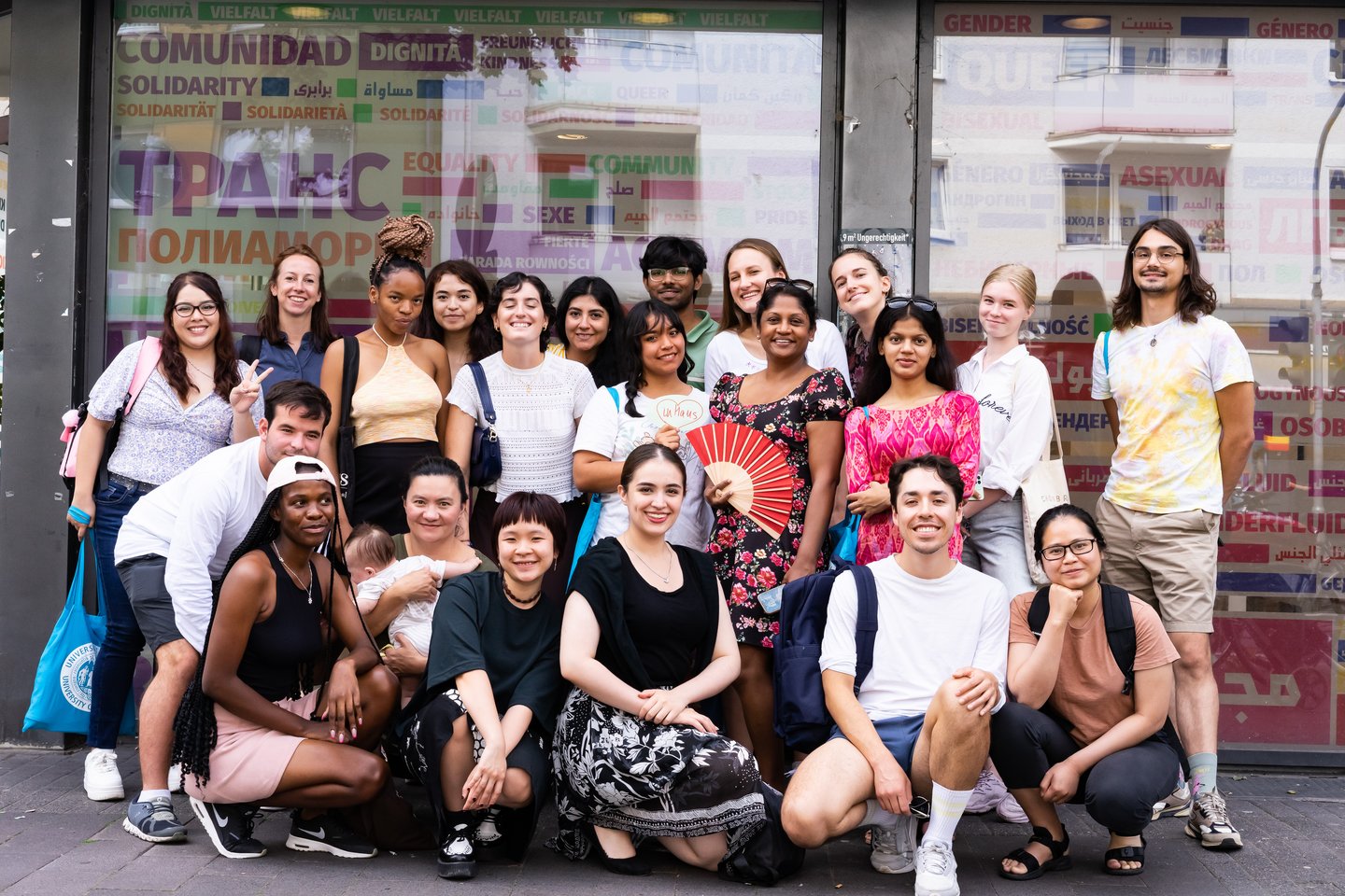 Group of students in front of a shop window